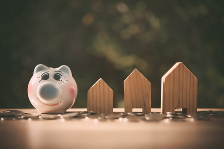 Saving to buy a house or home savings concept with money coin stack growing.Saving money concept.の写真素材