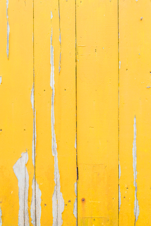 Grunge and old yellow wood panel texture background. Can be use as background texture or wallpaper.の写真素材