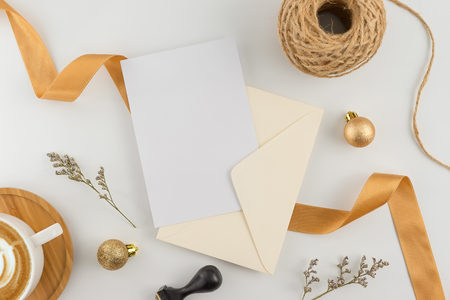 A wedding concept. Wedding Invitation, envelopes, cards Papers on white background with ribbon and decoration. Top view, flat lay, copy spaceの写真素材