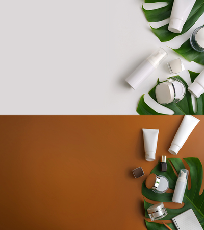 Set of white cosmetic products and green leaves on color background. Natural beauty products for branding mock-up concept.Top view with copy space. Flat layの写真素材