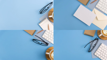 Flat lay, top view office table desk. Workspace with blank note book, keyboard, office supplies and coffee cup on light blue background.の写真素材