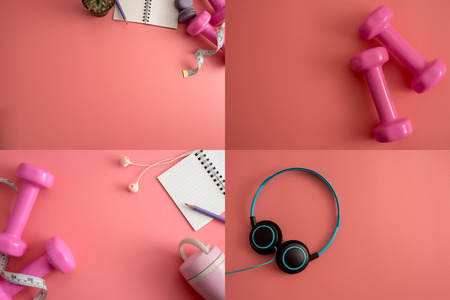 Set of fitness equipment dumbbells notepad pencil and earphone on pink background. Flat lay.の写真素材