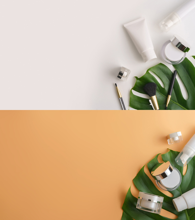 Set of white cosmetic products and green leaves on color background. Natural beauty products for branding mock-up concept.Top view with copy space. Flat layの写真素材