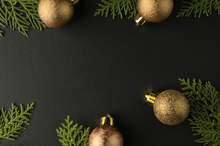 Christmas background with frame of fir branches and christmas ornament. Flat lay, top viewの写真素材