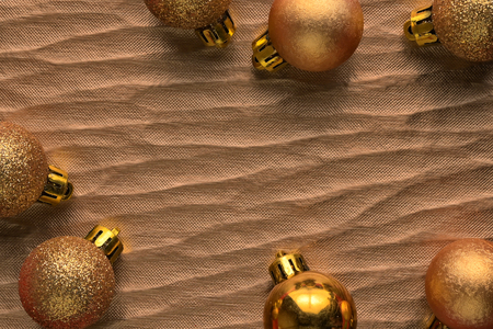 Flat lay, Top view minimal composition background of gold decorative Christmas ornaments. New Year and Christmas concept with copyspace.の写真素材
