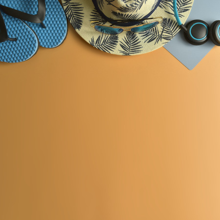 Flat lay, top view workspace with eye glasses, notebook, hat, sun block, shoes and coffee cup on yellow background. Summer stylish traveller blogger concept.の写真素材
