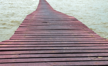 Wooden bridge into the seaの写真素材