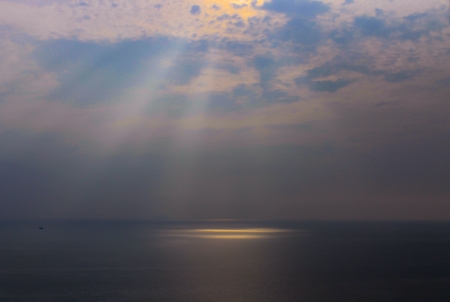 Sea landscape with light the cloudy skyの写真素材