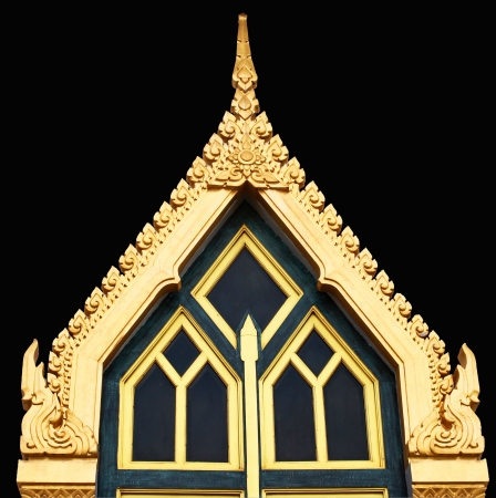 Thai temple door sculpture on black backgroundの写真素材