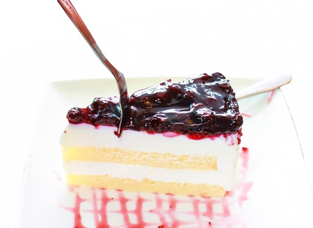 cheese cake with blue berry on white backgroundの写真素材