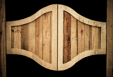 brown dirty vintage wooden door on black backgroundの写真素材