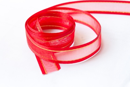 Red Tie from present ribbon  Isolated on white background の写真素材