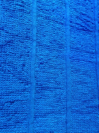 A fine texture of bright Blue bath towel の写真素材