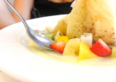 This is dessert fruit salad with ice creamの写真素材