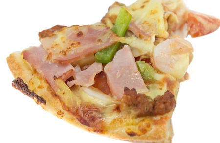 Slice of fresh pizza with ham isolated on whiteの写真素材