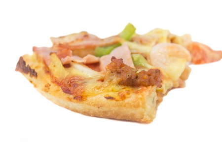 Slice of fresh pizza with ham isolated on whiteの写真素材