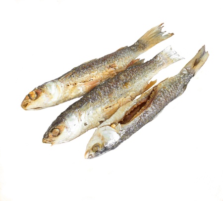 Three fried fish isolated in white backgroundの写真素材