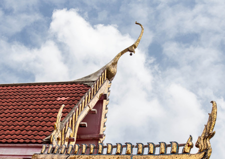 Thai art on roof at Thai temple の写真素材