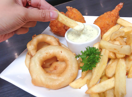 A plate of french fries with catchupの写真素材