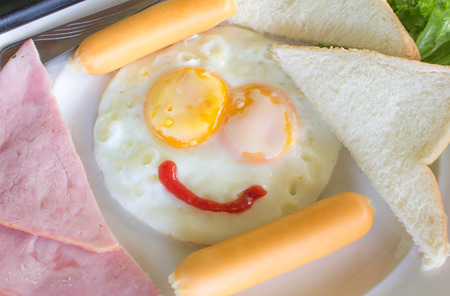The nice breakfast with fun with smile eggの写真素材
