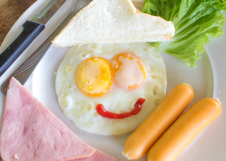 The nice breakfast with fun with smile eggの写真素材