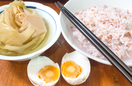 gruel and salted egg  and canned Vegetablesの写真素材