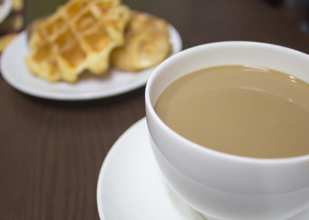 coffee and waffles on tableの写真素材
