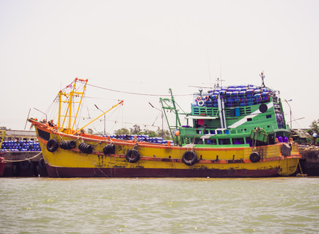 fishing boats  in harbour at  Thailandの写真素材