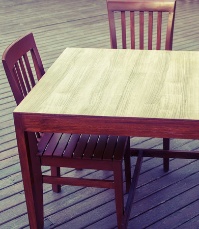 wooden table chairs on flooring wood