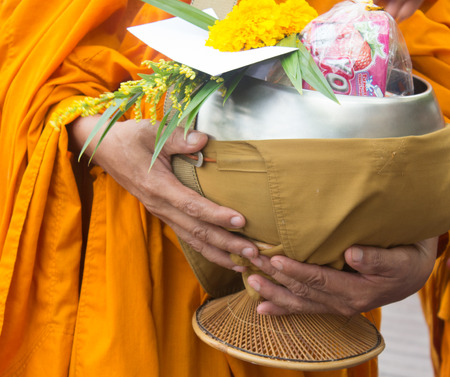 Buddhists have faith in Buddhism. giving alms to monks receive almsの写真素材