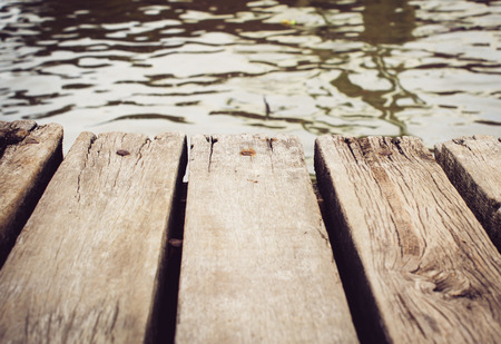 wood bridge riverside  on shoreの写真素材