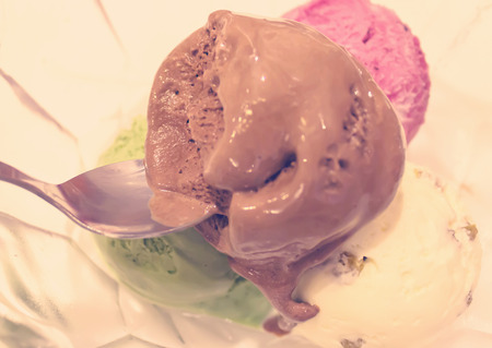 Four scoops of chocolate, strawberry vanilla and lemon ice creamの写真素材