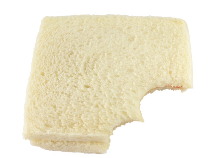 eating of bread on a white backgroundの写真素材