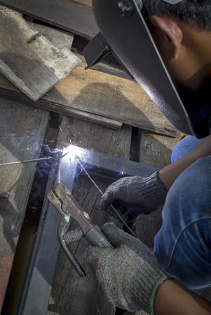 welder worker welding metal