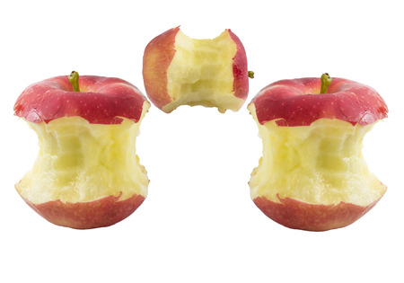 Bite three red apple core on a white backgroundの写真素材