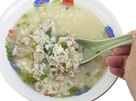 rice porridge with pork thai breakfast on whiteの写真素材