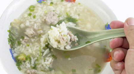 rice porridge with pork thai breakfast on whiteの写真素材