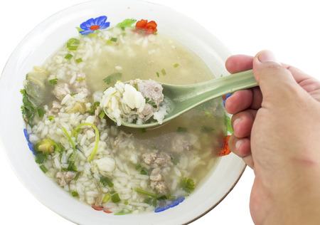 rice porridge with pork thai breakfast on whiteの写真素材