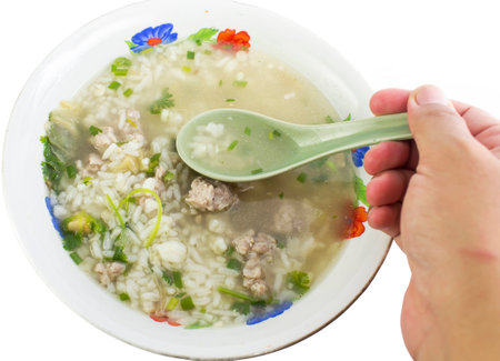 rice porridge with pork thai breakfast on whiteの写真素材