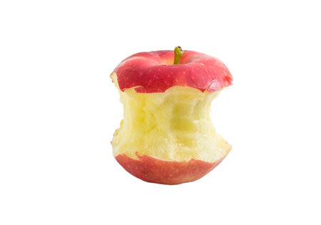 Bite  red apple core on a white backgroundの写真素材