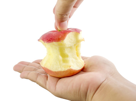 Bite red apple core on a white backgroundの写真素材