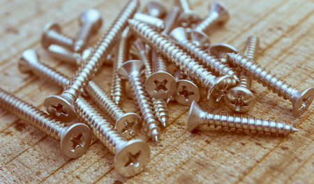 Screws located on woodden , retro style