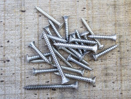 Screws located on wooddenの写真素材