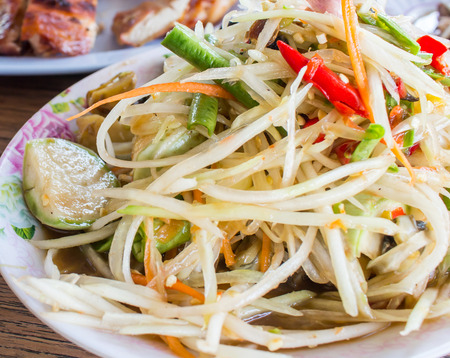 Thai food green papaya salad and grilled Chickenの写真素材