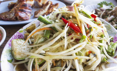 Thai food green papaya salad and grilled Chickenの写真素材
