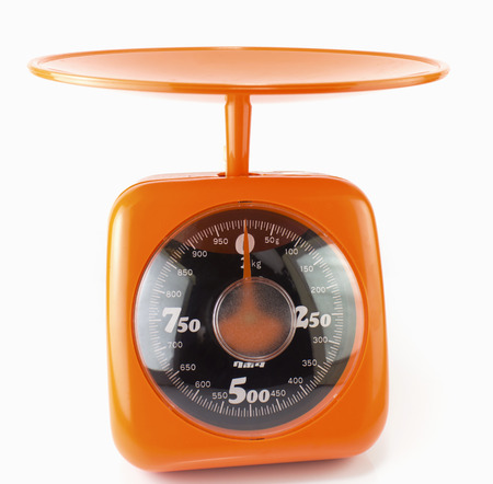 new orange  kitchen scale isolated on whiteの写真素材