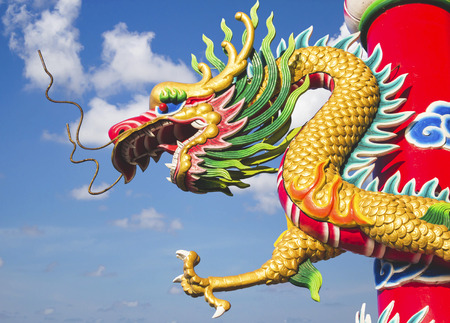 Dragon statue and l blue sky backgroundの写真素材
