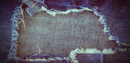 torn jeans texture with space for textの写真素材