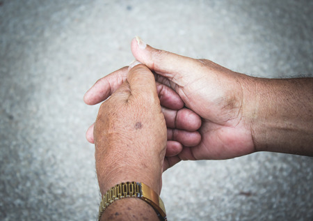 Hands of the old man