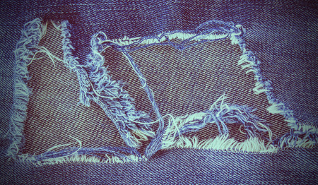 torn jeans texture with space for textの写真素材